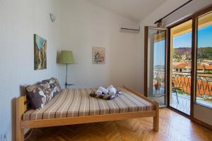 a bedroom with a bed with a view of a balcony at Pirate Backpackers in Ulcinj +64 photos