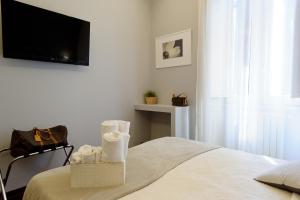 Postel nebo postele na pokoji v ubytování Borghese Executive Suite