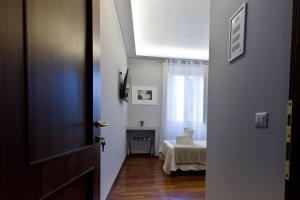Postel nebo postele na pokoji v ubytování Borghese Executive Suite
