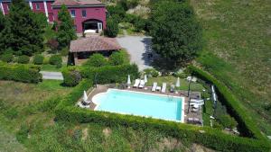 an aerial view of a house with a swimming pool at Agriturismo Tenuta Polledro in Asti
