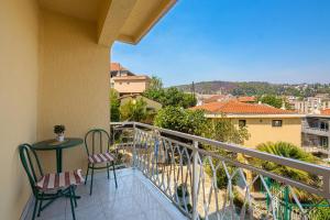 a balcony with two chairs and a table with a view at Pirate Backpackers in Ulcinj