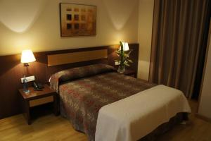 Postel nebo postele na pokoji v ubytování TCH Hotel