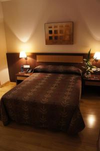 Postel nebo postele na pokoji v ubytování TCH Hotel