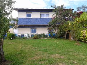 a large house with a yard in front of it at Casa Flori in Celorio