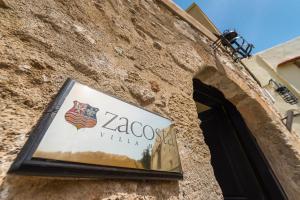 Um certificado, prêmio, placa ou outro documento exibido em Zacosta Villa Hotel