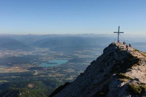 people on top of a mountain with a cross on top at Gästehaus Temitzhof in Latschach +4 photos