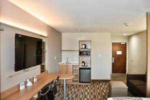 A television and/or entertainment centre at Microtel Inn & Suites by Wyndham Lubbock