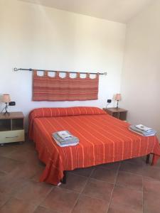 Un pat sau paturi într-o cameră la Villino Aurora