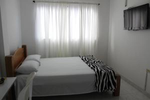 Postel nebo postele na pokoji v ubytování Hotel San Francisco Real