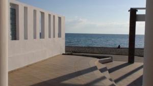 a building with a view of the ocean at Marine House Andrianna -Adults only in Siviri