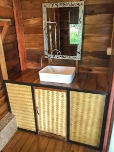 a bathroom with a sink and a mirror at Bayview Sunset in Ko Lipe