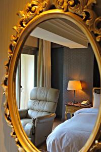 Letto o letti in una camera di JBG Hotspring Resort Hotel