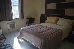 Postel nebo postele na pokoji v ubytování Hotel Calstar