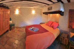 a bedroom with a large bed in a room at Les Chalets du Villard in Saint-Véran