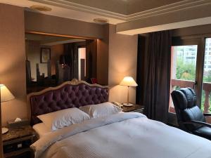 Letto o letti in una camera di JBG Hotspring Resort Hotel
