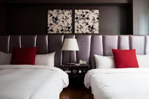 Letto o letti in una camera di JBG Hotspring Resort Hotel