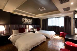 Letto o letti in una camera di JBG Hotspring Resort Hotel