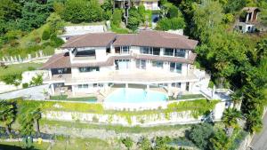 an aerial view of a house with a swimming pool at Il Girasole in Meina