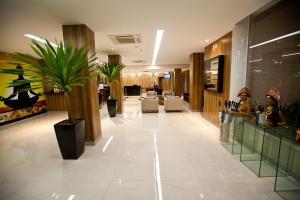 a lobby of a hospital with a pharmacy at ARCUS Hotel By Atlântica in Aracaju