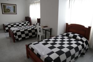 Postel nebo postele na pokoji v ubytování Hotel San Francisco Real