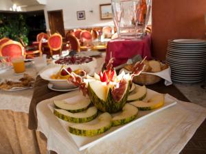 a table with a plate of food on a table at Hotel Begoña Park in Gijón