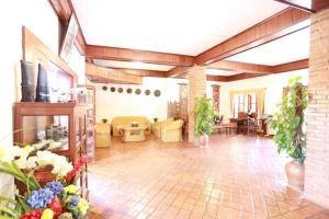 a living room with a couch and a table at Muangthong Boutique Hotel in Luang Prabang