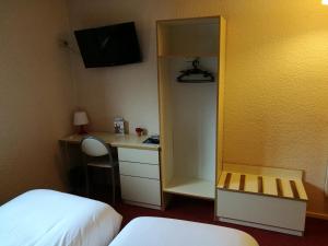 Postel nebo postele na pokoji v ubytování Lys Hôtel