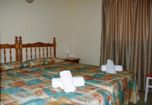 A bed or beds in a room at Don Miguel 1 - Arca Rent