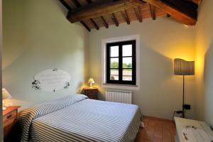 Postel nebo postele na pokoji v ubytování Agriturismo il Corniolo + 33 fotografií
