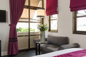 Postel nebo postele na pokoji v ubytování A23 Boutique Hotel