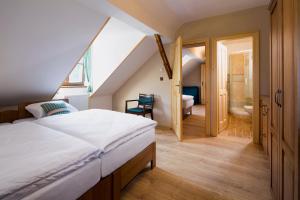 Voodi või voodid majutusasutuse Wellness Hotel Florián České Žleby toas