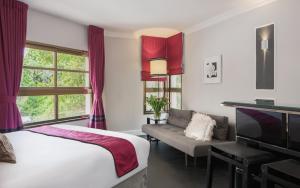 Postel nebo postele na pokoji v ubytování A23 Boutique Hotel