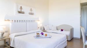 Postel nebo postele na pokoji v ubytování Hotel Palau