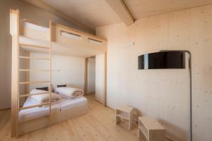 Letto o letti in una camera di Stoos Hüttä