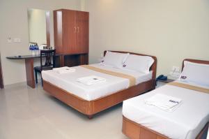 Katil atau katil-katil dalam bilik di Hotel Raams Park
