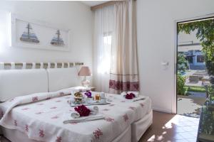 Postel nebo postele na pokoji v ubytování Hotel Palau