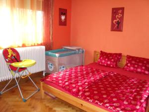 A bed or beds in a room at Viola Vendégház