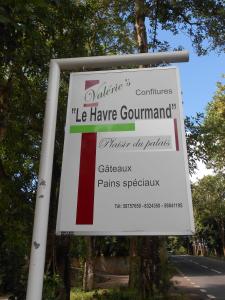 a sign for the le havre germanium of poland at Le Havre Gourmand in Rodrigues Island