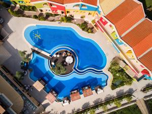 an overhead view of a swimming pool at a resort at Alexandra Golden Boutique Hotel-Adults Only in Chrysi Ammoudia