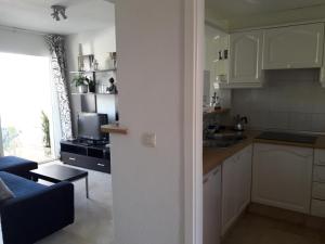Kuchyň nebo kuchyňský kout v ubytování Albir Sunshine Apartments