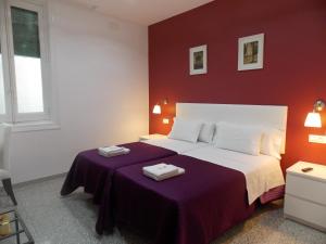 a bedroom with a bed with two towels on it at Pensión Corbero in Madrid