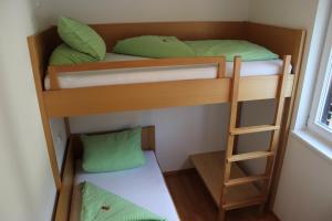 Postel nebo postele na pokoji v ubytování Haus Arosa