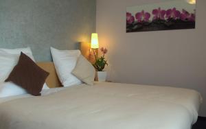 Postel nebo postele na pokoji v ubytování Hotel Beuss