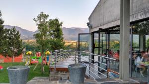 a view of a playground with mountains in the background at Alberg la Bruna in Bellver de Cerdanya 