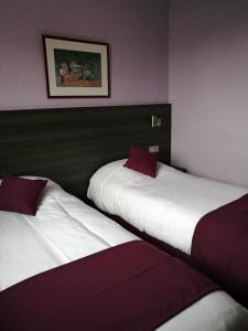 Postel nebo postele na pokoji v ubytování Lys Hôtel