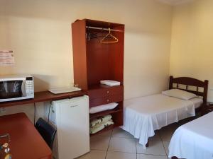 En eller flere senge i et værelse på Pousada Sol e Lua