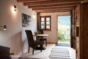 a room with a table and chairs and a window at La Foyère in Aime-La Plagne +15 photos