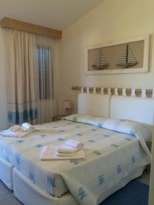Postel nebo postele na pokoji v ubytování Hotel Palau