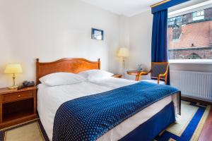 Posteľ alebo postele v izbe v ubytovaní Qubus Hotel Wrocław