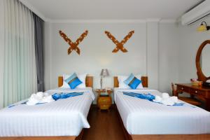 Postel nebo postele na pokoji v ubytování Princess River Kwai Hotel